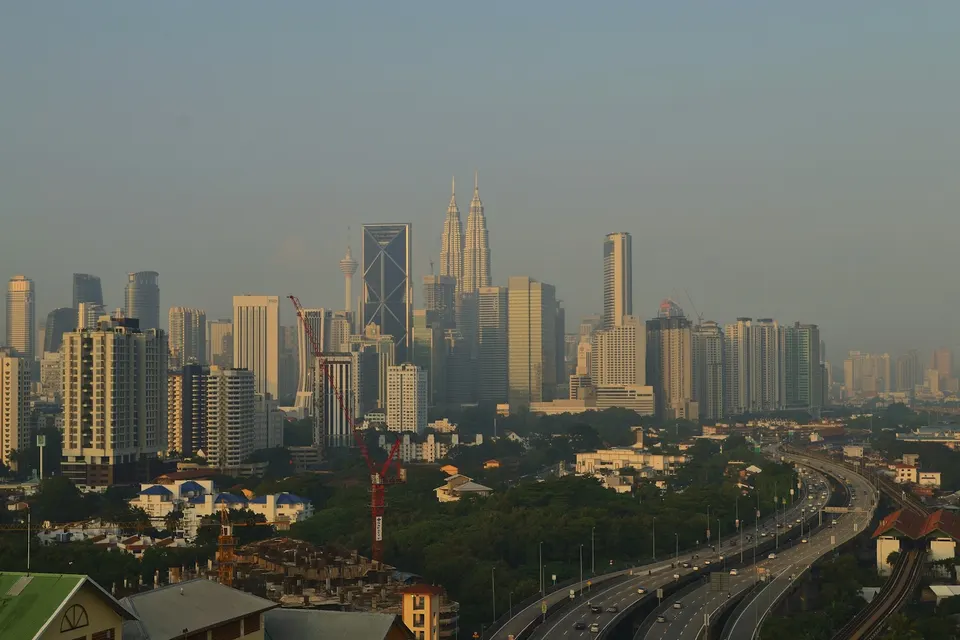 The Kuala Lumpur skyline above roads and city buildings